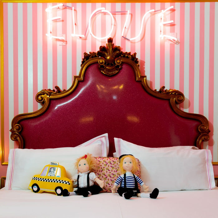 2 Eloise dolls on display in the Eloise Suite at The Plaza Hotel