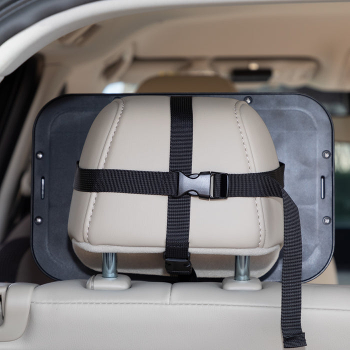 A close-up of a car seat headrest displays the Adjustable Backseat Baby View Mirror, a black organizer securely mounted with adjustable straps and a buckle.