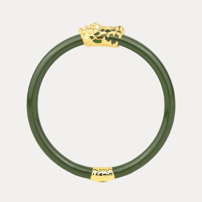 a green and gold bracelet with a crocodile head