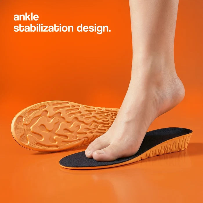 Height insoles with ankle stabilization design, featuring a black top layer and orange base, placed beside a foot on an or...