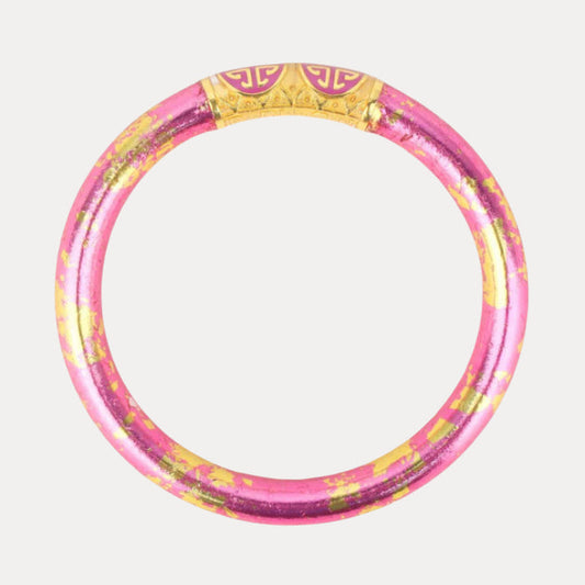 a pink and gold ring