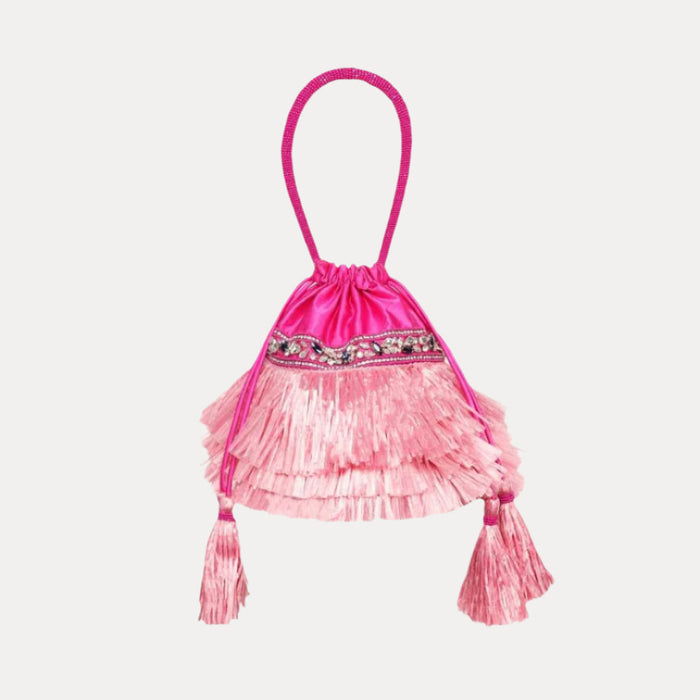 a pink bag with tassels