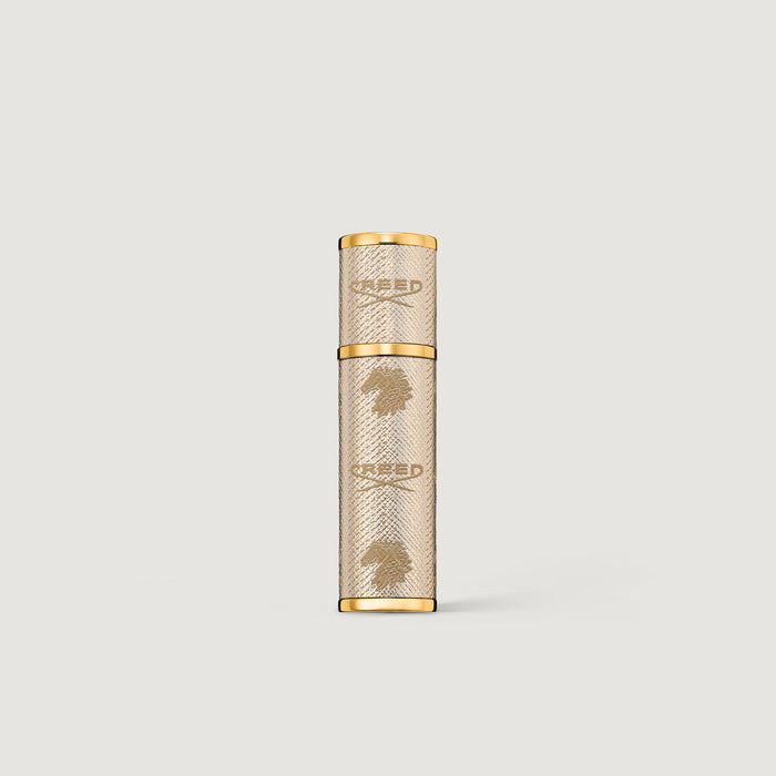 Creed gold leather 5ml travel perfume atomizer with embossed logo - Front View | Creed Boutique