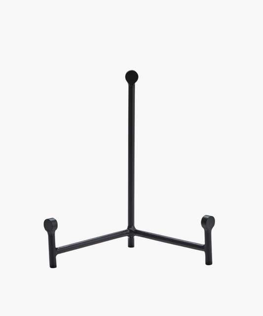 Minimalist black metal easel stand with three legs and a vertical support. The stand is sleek and modern in design. | SW Home