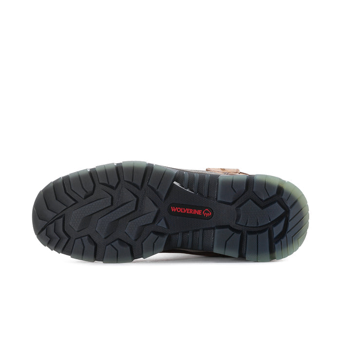 Boot outsole with dark tread and WOLVERINE logo, green accents